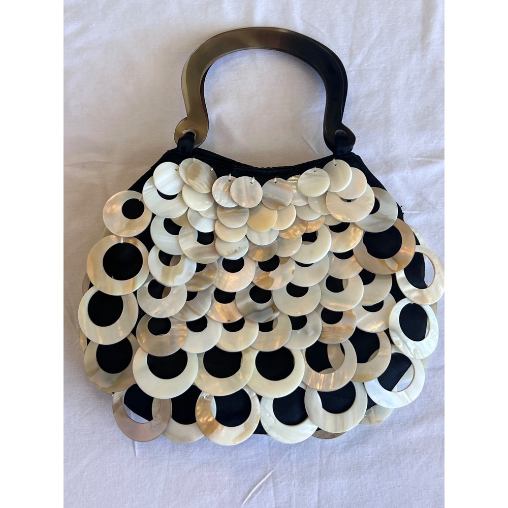 Mad by Design shell purse with horn handles.